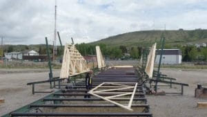 All Span Building Systems - Truss Manufacturing - Calgary Alberta - Truss Rolling out to be stacked